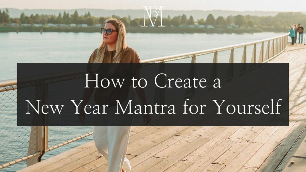 A promotional banner featuring a woman standing on a boardwalk over water with text overlay, 'How to Create a New Year Mantra for Yourself', for a lifestyle blog post